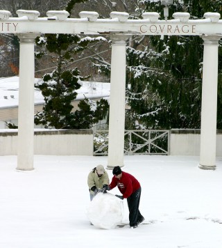 students making a snowman in the greek theatre